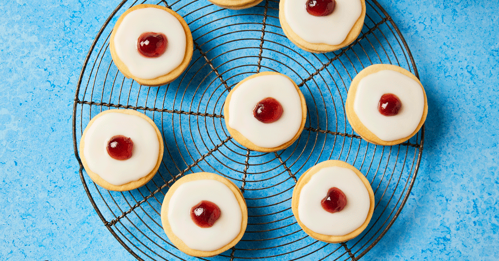 Top-down view of classic Empire Biscuits with cherries on top.